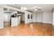 Spacious living area with wood floors and arched doorways to other parts of the home at 13516 Copper Head Dr, Riverview, FL 33569
