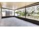 An inviting screened porch overlooks the well-maintained yard and storage shed at 13516 Copper Head Dr, Riverview, FL 33569