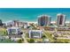 Aerial view of beachfront condos with pools, tennis courts, and easy access to the beach and Intracoastal Waterway at 1581 Gulf Blvd # 102N, Clearwater Beach, FL 33767