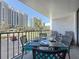 Balcony with table, seating, and city view at 1581 Gulf Blvd # 102N, Clearwater Beach, FL 33767