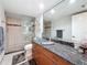 Updated bathroom with glass bowl sink, wood vanity, and glass shower at 1581 Gulf Blvd # 102N, Clearwater Beach, FL 33767