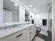 Modern bathroom with double sinks, white marble vanity, and sleek fixtures at 1581 Gulf Blvd # 102N, Clearwater Beach, FL 33767