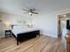 Bedroom featuring a ceiling fan, neutral decor, and ensuite bath at 1581 Gulf Blvd # 102N, Clearwater Beach, FL 33767
