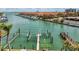 Waterfront property features private dock with boat lift for easy water access at 1581 Gulf Blvd # 102N, Clearwater Beach, FL 33767