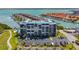 Exterior full view of the condo building with multiple floors and a parking area at 1581 Gulf Blvd # 102N, Clearwater Beach, FL 33767