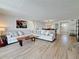 Spacious living room featuring a large sectional sofa and an open floorplan at 1581 Gulf Blvd # 102N, Clearwater Beach, FL 33767