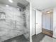 Modern bathroom features a luxurious glass and marble tile shower at 1581 Gulf Blvd # 102N, Clearwater Beach, FL 33767