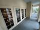 Balcony featuring beige walls, gray flooring, and access through elegant French doors at 200 4Th S Ave # 231, St Petersburg, FL 33701