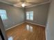 Bedroom with natural light from two windows and wood flooring at 200 4Th S Ave # 231, St Petersburg, FL 33701