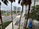 Features a street view framed by palm trees, city buildings, and visible crosswalk at 200 4Th S Ave # 231, St Petersburg, FL 33701