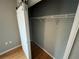 Bedroom closet with wooden floors, gray walls and a functional sliding barn-style door at 200 4Th S Ave # 231, St Petersburg, FL 33701