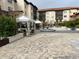 Inviting courtyard area featuring a serene fountain, patio furniture, and paved brick at 200 4Th S Ave # 231, St Petersburg, FL 33701
