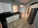 Open concept kitchen showcasing granite counters, tile backsplash, and stainless steel appliances at 200 4Th S Ave # 231, St Petersburg, FL 33701
