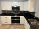 Well-equipped kitchen with granite counters, stainless steel appliances, and ample cabinet space at 200 4Th S Ave # 231, St Petersburg, FL 33701