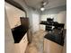 Modern kitchen features granite countertops, stainless steel appliances, and tiled floors at 200 4Th S Ave # 231, St Petersburg, FL 33701