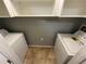 Convenient laundry area with white appliances and built-in shelving for storage at 200 4Th S Ave # 231, St Petersburg, FL 33701