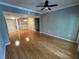 Bright living room with wood floors, ceiling fan and easy access to kitchen at 200 4Th S Ave # 231, St Petersburg, FL 33701