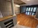 Spacious living room with hardwood floors, modern lighting, and neutral wall paint at 200 4Th S Ave # 231, St Petersburg, FL 33701