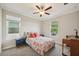 Bedroom with carpeted floors and view of the backyard at 8364 Capstone Ranch Dr, New Port Richey, FL 34655