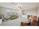 Large bonus room with a wet bar, mini-fridge, and ample seating at 8364 Capstone Ranch Dr, New Port Richey, FL 34655