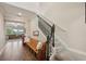 Inviting foyer with a wooden bench and staircase to the upper level at 8364 Capstone Ranch Dr, New Port Richey, FL 34655