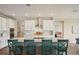 Modern kitchen with white cabinetry, stainless steel appliances and a large island with seating at 8364 Capstone Ranch Dr, New Port Richey, FL 34655