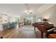 Bright, open-plan living room with hardwood floors and a view of the water at 8364 Capstone Ranch Dr, New Port Richey, FL 34655