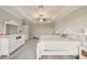 Comfortable main bedroom with a tray ceiling, dresser, and spacious layout at 8364 Capstone Ranch Dr, New Port Richey, FL 34655