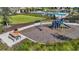 Community playground with picnic table and benches offers a fun outdoor space at 8364 Capstone Ranch Dr, New Port Richey, FL 34655