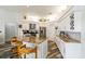 Modern kitchen with granite countertops, stainless steel appliances, and a cozy breakfast bar at 1647 Stable Trl, Palm Harbor, FL 34685