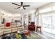 Open-concept living room with a view of the kitchen, featuring modern furnishings and a bright atmosphere at 1647 Stable Trl, Palm Harbor, FL 34685