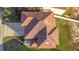 Aerial view of a home with a brown roof at 7327 Brightwaters Ct, New Port Richey, FL 34652