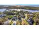 Expansive aerial shot showcases a home in a picturesque neighborhood near the water at 7327 Brightwaters Ct, New Port Richey, FL 34652