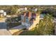 Aerial shot of a house featuring a driveway and pond in the back at 7327 Brightwaters Ct, New Port Richey, FL 34652