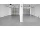 Epoxy floor garage with two garage doors at 7327 Brightwaters Ct, New Port Richey, FL 34652