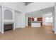 Bright living room and kitchen combo with stylish fireplace and open floor plan at 7327 Brightwaters Ct, New Port Richey, FL 34652