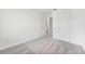 Bright bedroom featuring plush gray carpet at 11905 Sylvia St, Dade City, FL 33525