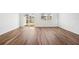 Open-concept living area featuring vinyl floors, a large window, and natural light at 11905 Sylvia St, Dade City, FL 33525