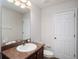 Bathroom featuring a vanity with a sink, a mirror, and a toilet at 12402 Creek Edge Dr, Riverview, FL 33579