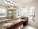 Lavish bathroom with granite countertops, a soaking tub, and a separate glass shower at 12402 Creek Edge Dr, Riverview, FL 33579