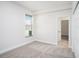 This bedroom features soft carpeting, a window, and easy access to closet space at 12402 Creek Edge Dr, Riverview, FL 33579
