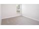 This bedroom boasts neutral carpeting and a bright window at 12402 Creek Edge Dr, Riverview, FL 33579