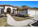 Stunning front exterior showcasing the walkway, stone-lined flowerbeds, manicured lawn, and mature tropical landscaping at 12402 Creek Edge Dr, Riverview, FL 33579