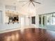 Open-concept layout with tile and hardwood floors, connecting the living area to the kitchen and outdoor spaces at 12402 Creek Edge Dr, Riverview, FL 33579