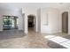 Inviting living room featuring tile and wood flooring, neutral walls, and open layout with natural light at 12402 Creek Edge Dr, Riverview, FL 33579