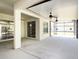 Spacious covered patio featuring ceiling fans, providing a perfect space for outdoor relaxation and entertainment at 12402 Creek Edge Dr, Riverview, FL 33579