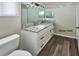 This bright Primary bath features gray countertops, modern vanity, and updated lighting at 1610 Spinning Wheel Dr, Lutz, FL 33559