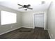Bedroom includes a ceiling fan, window and closet at 1610 Spinning Wheel Dr, Lutz, FL 33559