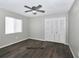 Bedroom includes a ceiling fan, window and closet at 1610 Spinning Wheel Dr, Lutz, FL 33559