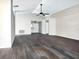 Open-concept living room with vaulted ceilings and stylish flooring, leading to the front door at 1610 Spinning Wheel Dr, Lutz, FL 33559